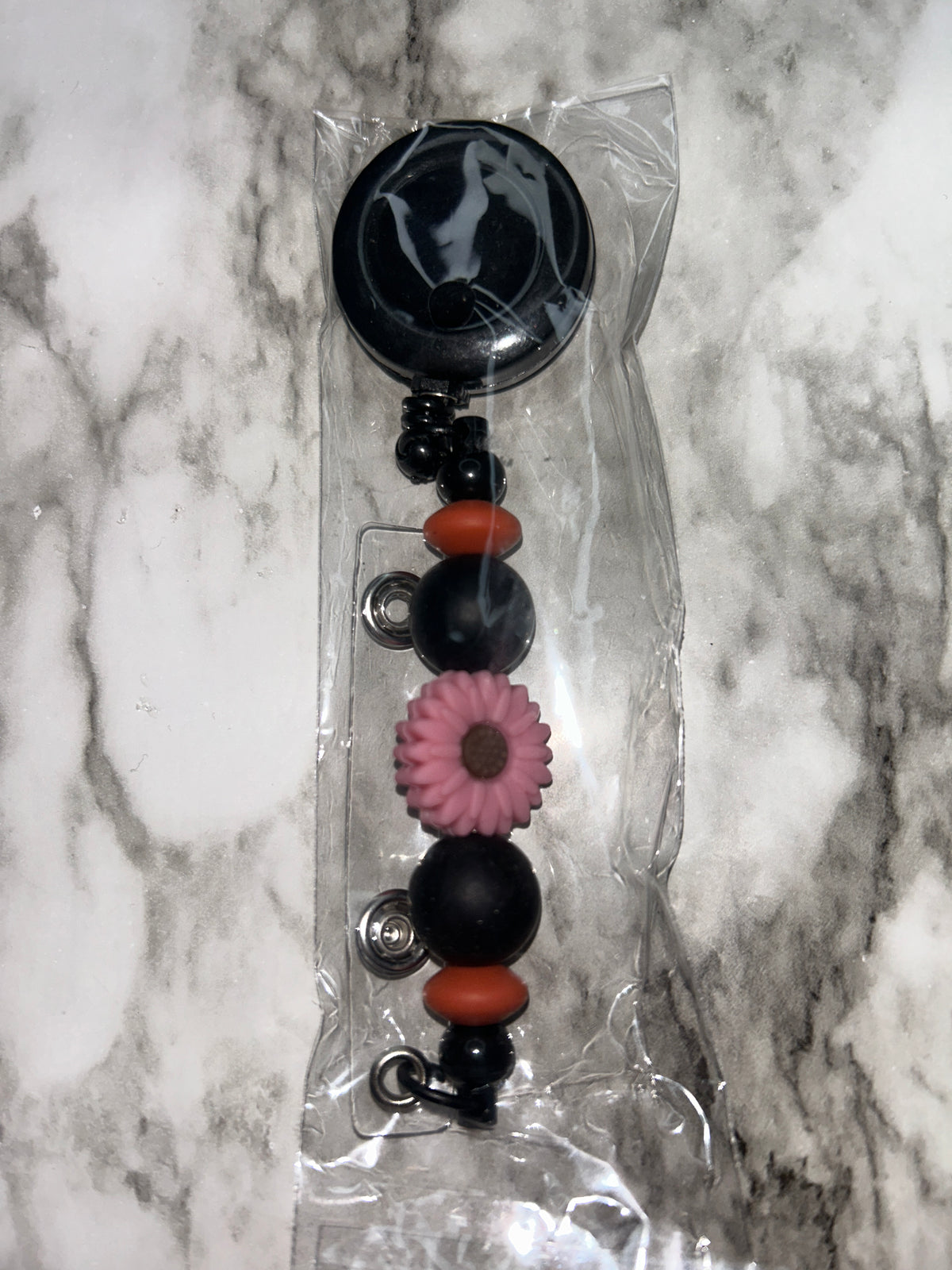 Beaded Badge Reel Black Flower Focal