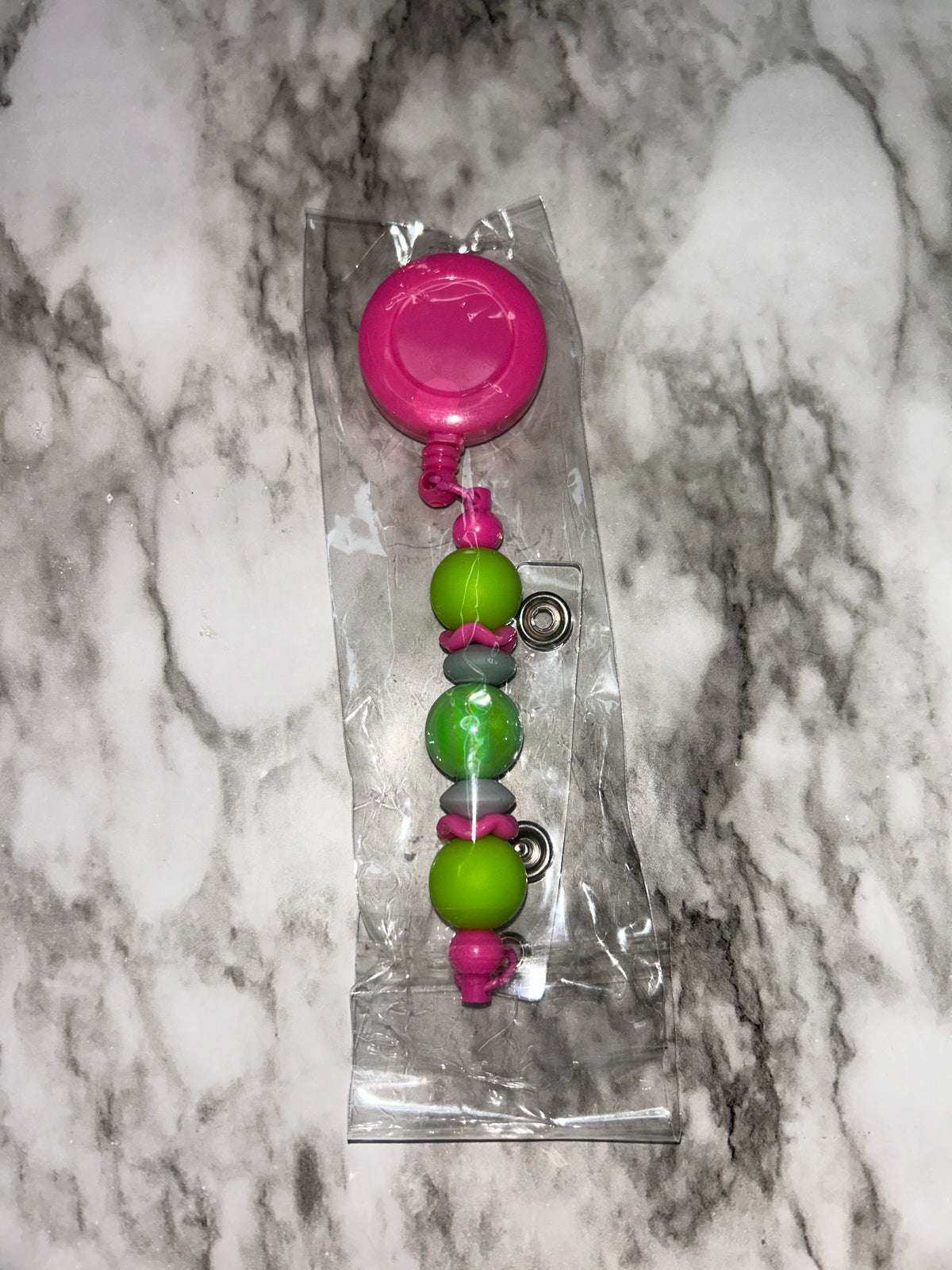 Badge Reel Pink Green