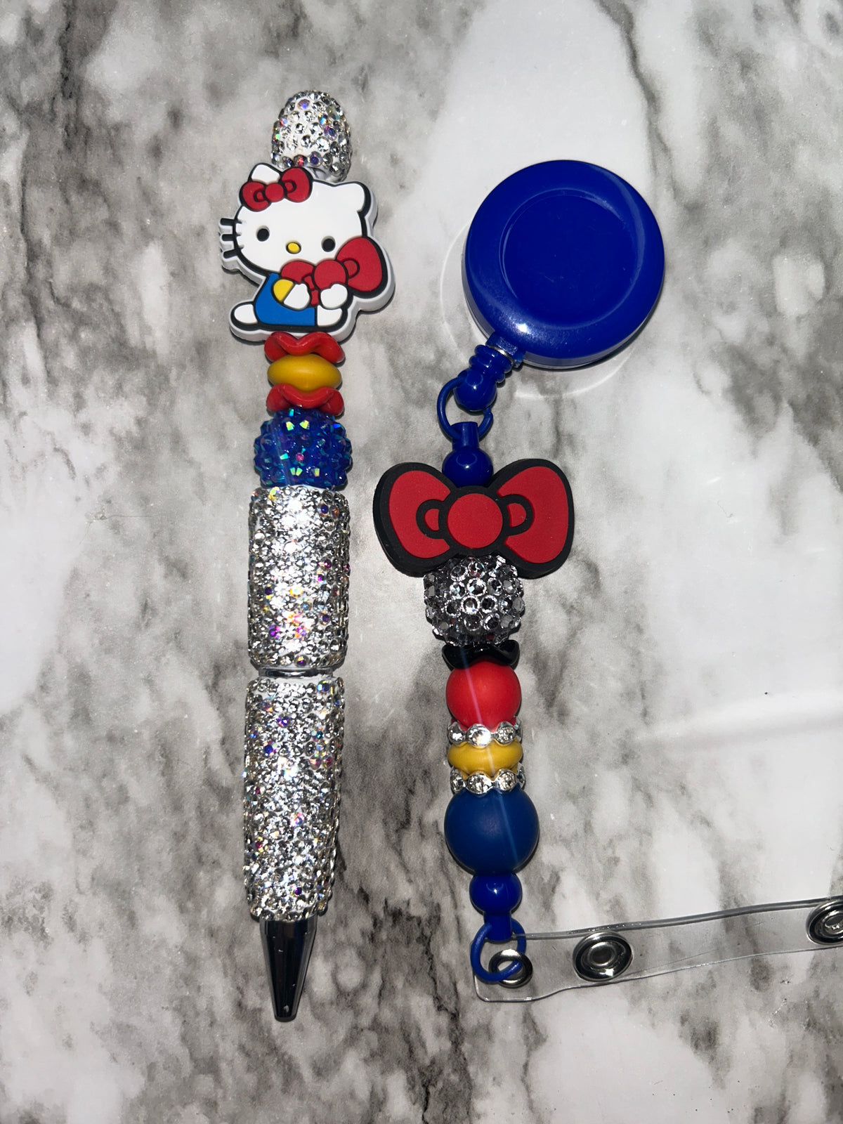 HK Pen and Badge Reel Blue Red